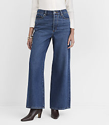 A person in wide-leg jeans and a white shirt stands against a plain white background. carousel Product Image 1
