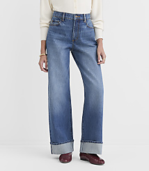 A person stands in cuffed wide-leg jeans and burgundy loafers against a plain white background. carousel Product Image 1
