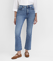 A person wearing blue denim jeans and brown flats stands against a plain white background. carousel Product Image 1