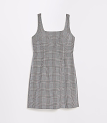 A sleeveless, plaid mini dress with a square neckline is displayed against a plain white background. carousel Product Image 5