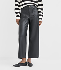 A person wearing black faux leather pants and a striped sweater stands against a plain white background. carousel Product Image 2