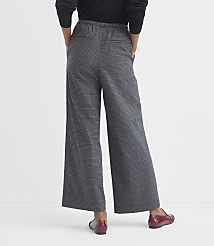 A person wearing plaid wide-leg pants and red loafers stands against a plain white background. carousel Product Image 3