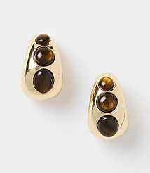 A pair of gold teardrop earrings with three brown cabochon stones are displayed against a plain white background. carousel Product Image 1