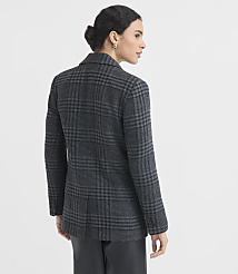 A woman in a plaid blazer and dark pants stands against a plain white background. carousel Product Image 3