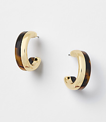Two gold and tortoiseshell hoop earrings are displayed against a plain white background. carousel Product Image 1
