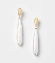 A pair of gold and pearl drop earrings hang against a plain white background. carousel Product Image 1