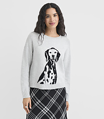 A woman in a grey sweater with a Dalmatian print stands against a plain background. carousel Product Image 1
