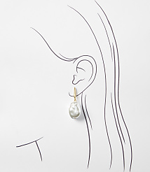 A single baroque pearl earring hangs from a stylized ear against a plain white background. carousel Product Image 2