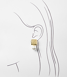A gold square stud earring with a pearl drop adorns a stylized ear against a white background with sketched hair. carousel Product Image 2
