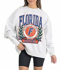 A woman in a grey sweatshirt with "Florida Gators" emblazoned on it stands against a white background. carousel Product Image 1
