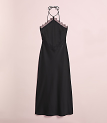 A black satin slip dress with lace trim hangs against a soft pink background. carousel Product Image 4