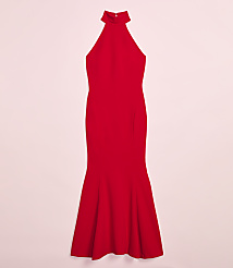 A vibrant red, floor-length halter dress with a flared hemline is presented against a soft pink background. carousel Product Image 4