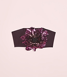 A dark plum headband with a large, sequined floral embellishment sits against a soft pink background. carousel Product Image 4