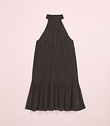 A dark, flowing halter dress with a ruffled hem rests on a soft pink background. carousel Product Image 4