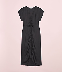 A black ruched midi dress is displayed against a soft pink background. carousel Product Image 2