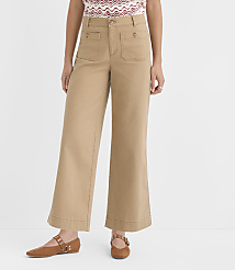 A person stands in tan wide-leg pants and brown flats against a plain white background. carousel Product Image 2