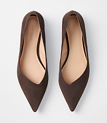 A pair of brown pointed-toe flats are laid out on a plain white background. carousel Product Image 3