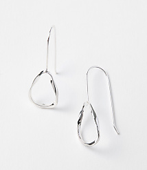 Two abstract, silver drop earrings with organic shapes hang against a plain white background. carousel Product Image 1