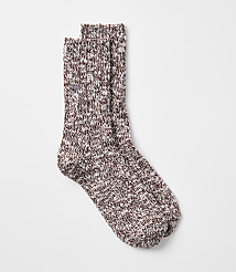A pair of speckled maroon and cream socks rests on a plain white background. carousel Product Image 1