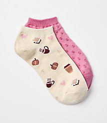 A pair of cream-colored ankle socks with a pattern of autumn-themed icons like pumpkins and coffee cups are laid out against a plain white background. carousel Product Image 1