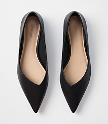 A pair of black pointed-toe flats rests on a plain white background. carousel Product Image 3