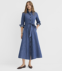 A woman in a denim shirt dress stands against a plain white background. carousel Product Image 2