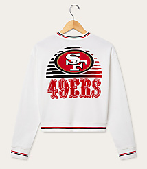 A white San Francisco 49ers sweatshirt with a graphic design on the back hangs on a wooden hanger against a plain white background. carousel Product Image 2
