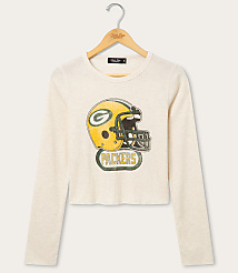 A cream-colored long-sleeved shirt with a vintage Green Bay Packers helmet graphic is displayed on a hanger against a plain white background. carousel Product Image 1