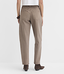 A person wearing brown jeans and boots stands against a plain white background. carousel Product Image 4