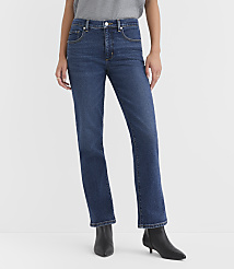 A person wearing dark wash straight-leg jeans and black heeled boots stands against a plain white background. carousel Product Image 2