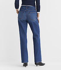 A person wearing blue jeans and black heeled boots stands against a plain white background. carousel Product Image 3