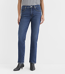 A person stands in dark wash straight-leg jeans and black ankle boots against a plain white background. carousel Product Image 1