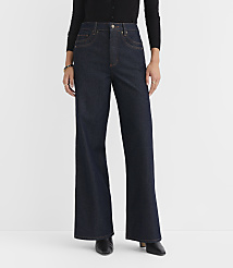 A person stands in dark wash wide-leg jeans and a black cardigan against a plain white background. carousel Product Image 2