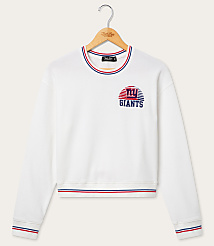 A white New York Giants sweatshirt with striped trim hangs on a wooden hanger against a plain white background. carousel Product Image 1