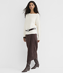A woman in a cream sweater and brown skirt stands against a plain white background. carousel Product Image 2