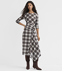 A woman in a plaid dress and boots stands against a plain white background. carousel Product Image 2