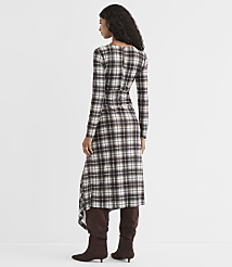 A woman in a plaid dress and brown boots stands against a plain white background. carousel Product Image 4