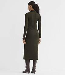 A woman in a ribbed olive green dress and brown boots stands against a plain white background. carousel Product Image 3
