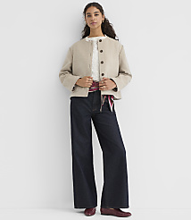 A woman in a beige jacket and dark wide-leg jeans stands against a plain white background. carousel Product Image 5