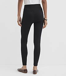 A person wearing black leggings and patterned flats stands against a plain white background. carousel Product Image 3