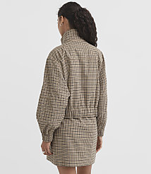 A woman in a plaid jacket and skirt stands against a plain white background. carousel Product Image 3