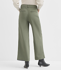 A person wearing olive green wide-leg pants and black boots stands against a plain white background. carousel Product Image 3