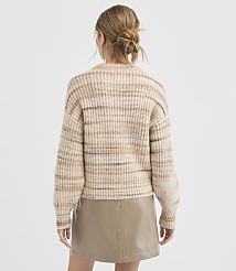 A woman in a striped sweater and leather skirt stands against a plain white background. carousel Product Image 4