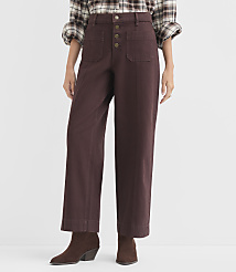 A person stands in front of a white background wearing brown wide-leg pants and a plaid shirt, with brown boots on their feet. carousel Product Image 2