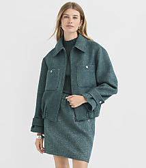 A woman in a teal tweed jacket and skirt stands against a plain white background. carousel Product Image 1
