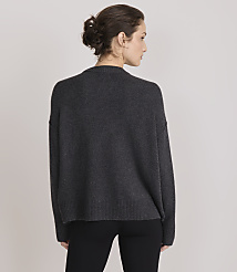 A woman in a dark grey sweater and black pants stands against a plain grey background. carousel Product Image 3