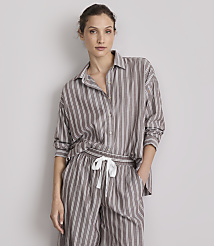 A woman in striped pajamas stands against a plain gray background. carousel Product Image 2