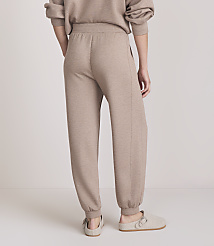 A person wearing beige sweatpants and slippers stands against a plain, light-colored background. carousel Product Image 3