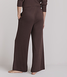 A person wearing brown ribbed pajama pants stands with their back to the camera against a plain, light gray background. carousel Product Image 3