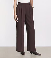 A person stands in brown wide-leg trousers and patterned boots against a plain white background. carousel Product Image 2